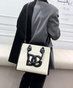 Design  Canvas shopper with calfskin nappa details