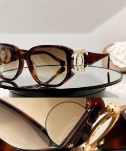 Design authentic pair of CHANEL CC Sunglasses